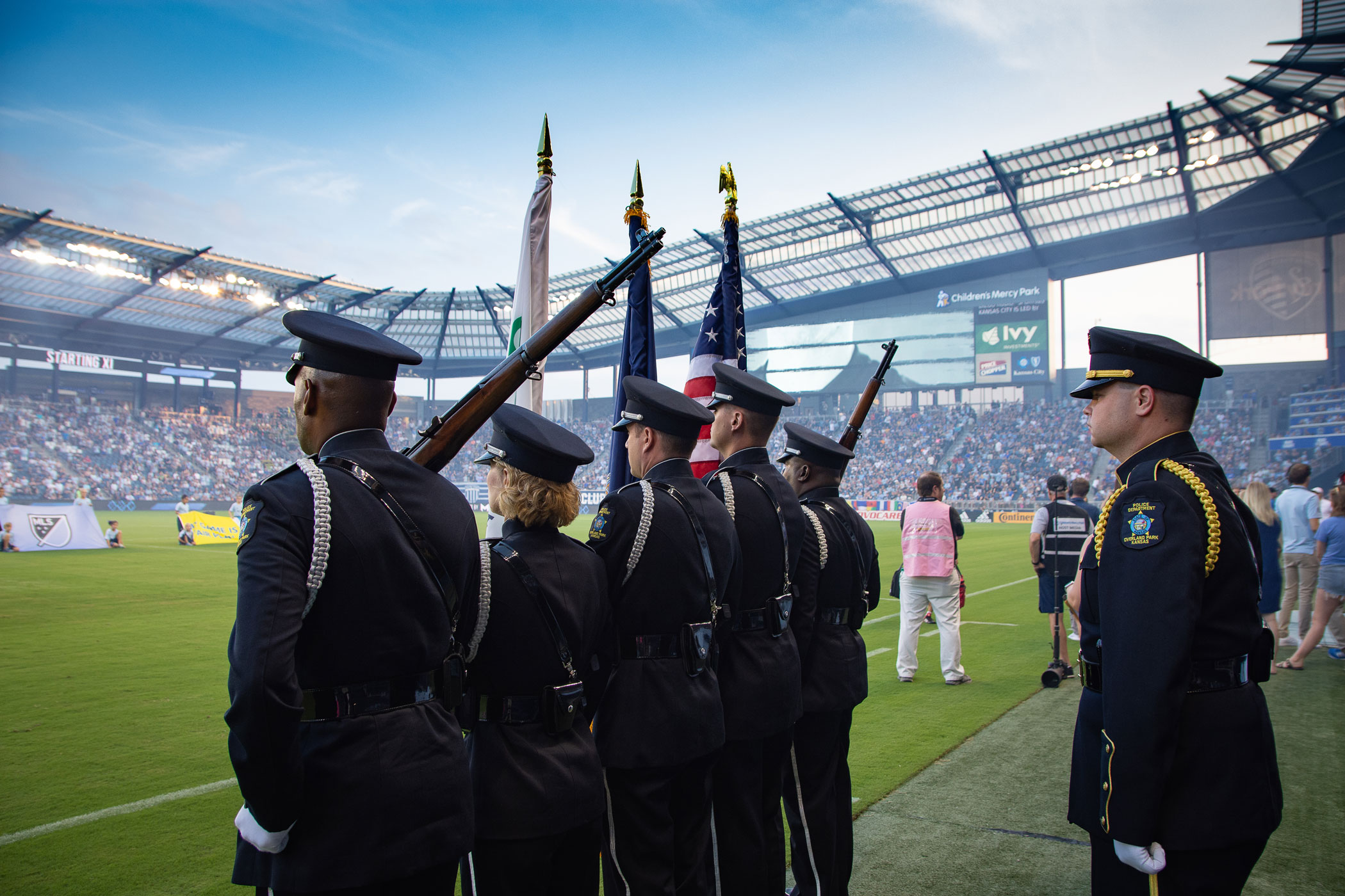Overland Park Police Department color guard waits at attention to enter Sporting KC field