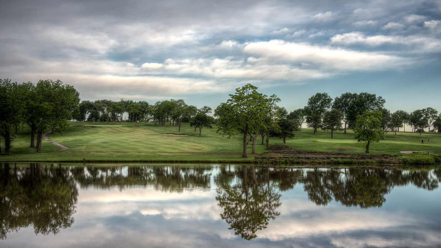Trees and water at Sykes/Lady Overland Park Golf Club