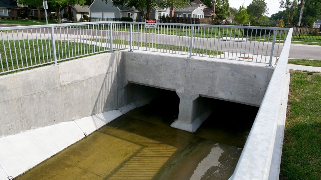 Storm drainage run under a neighborhood street.
