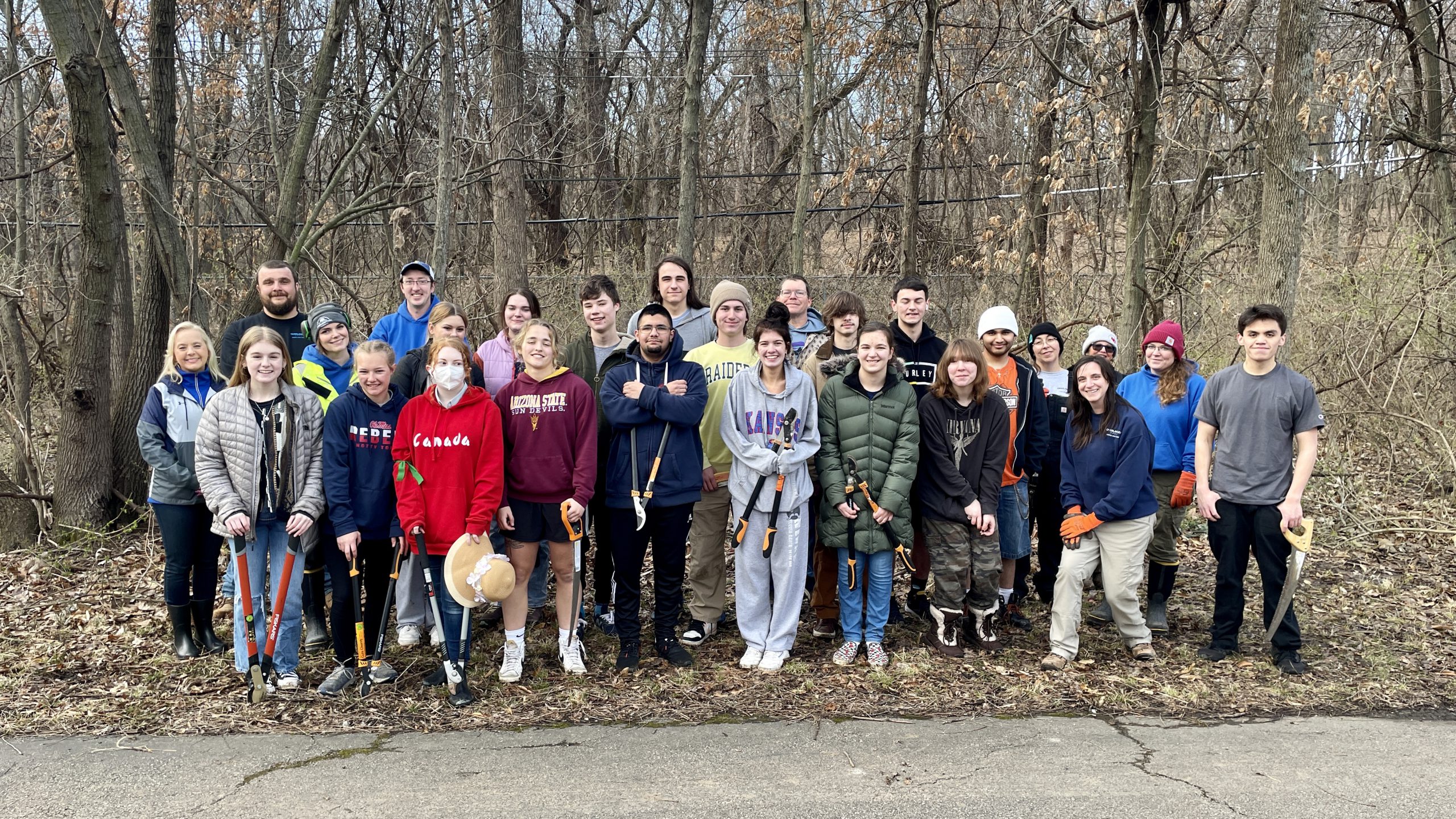 City staff, students work together to clear invasive species City of
