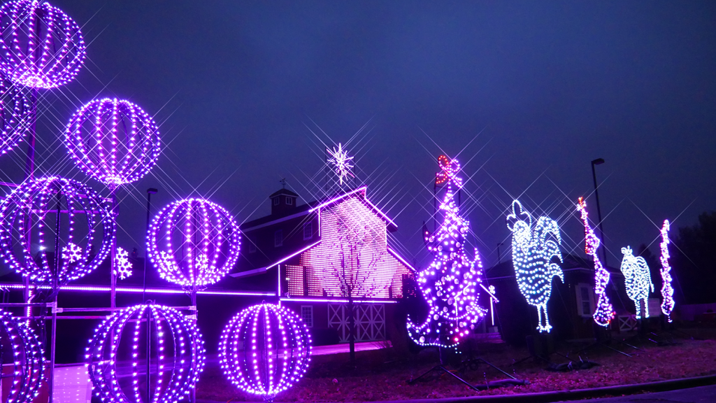 Holiday Lights at Farmstead Lane glow purple.