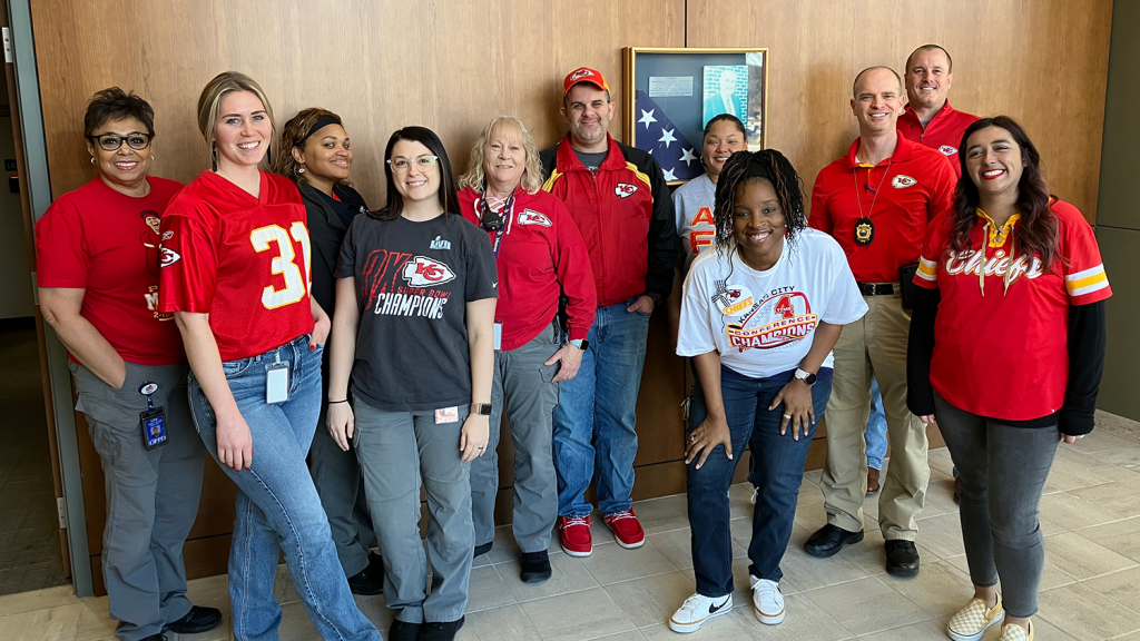 A group of Overland Park staff members wear Chiefs attire on Red Friday.