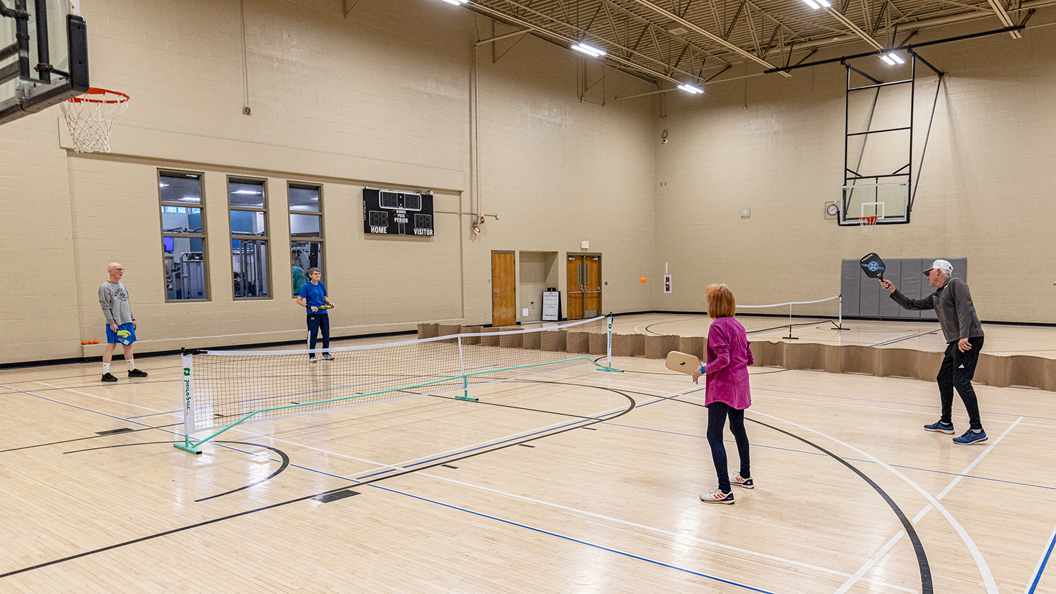 A foursome playing pickleball at the Tomahawk Ridge Community Center gym.