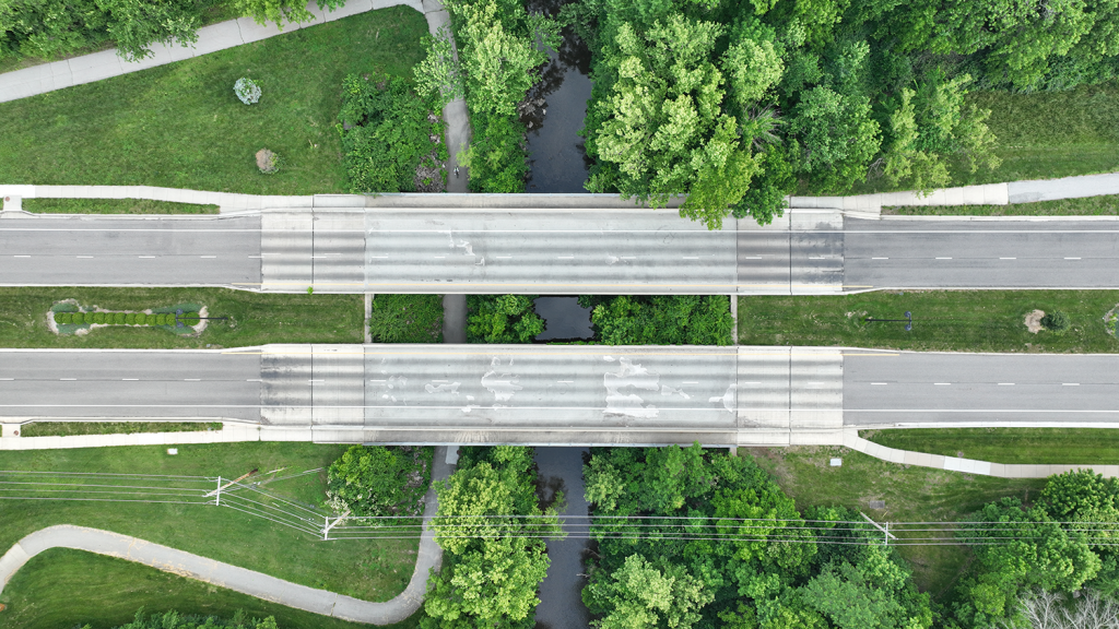 Aerial view of two street bridges over a creek at 127th Street and Nall.
