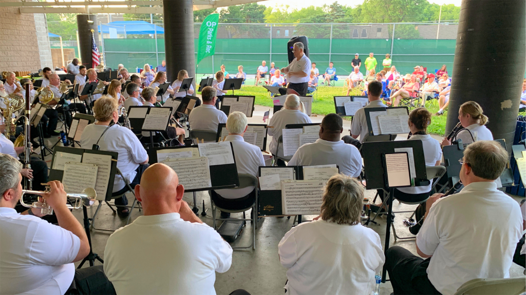 The Overland Park Civic Band performs outside.