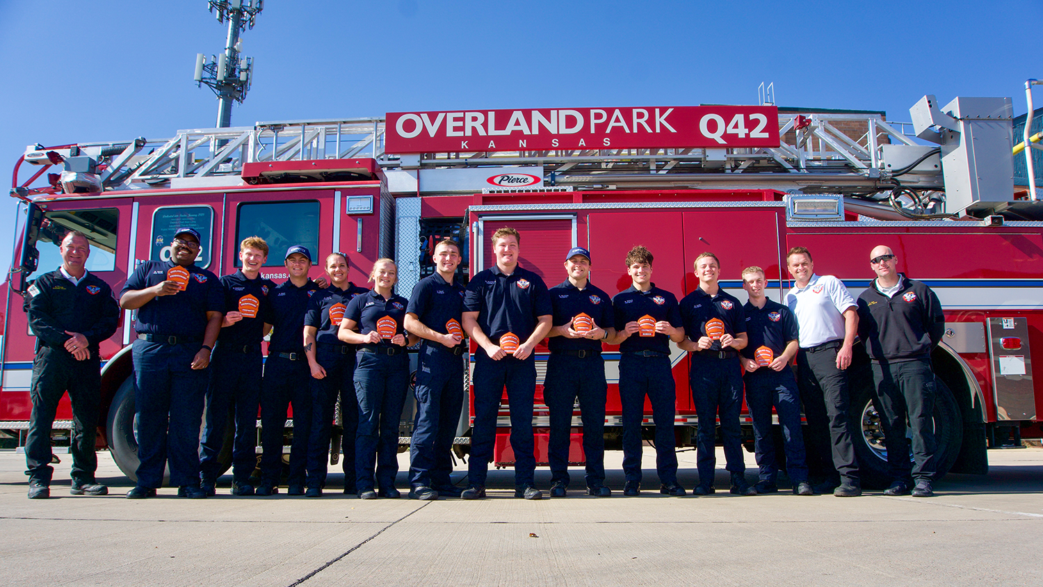 The OPFD Fire Science program stands for a photo outside a fire truck.
